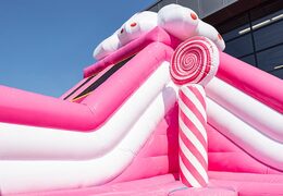 Acquistare un parco gonfiabile completo con ostacoli e scivolo con il tema caramelle
