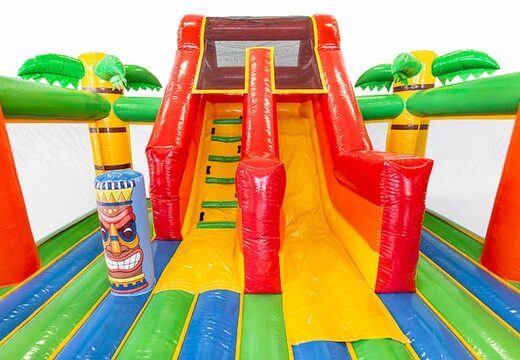 Acquista una castello gonfiabile a tema Hawaii con uno scivolo per bambini. Acquista castelli gonfiabili online su JB Gonfiabili Italia