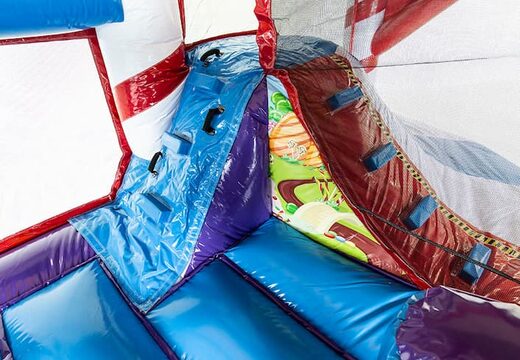 Acquistare un multiattività gonfiabile grande coperto con ostacoli e scivolo con il tema caramelle