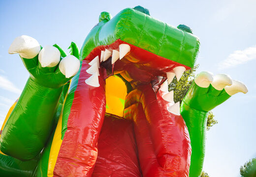 Vendo cuscino gonfiabile multigiocatore con scivolo in tema dinosauro giallo verde